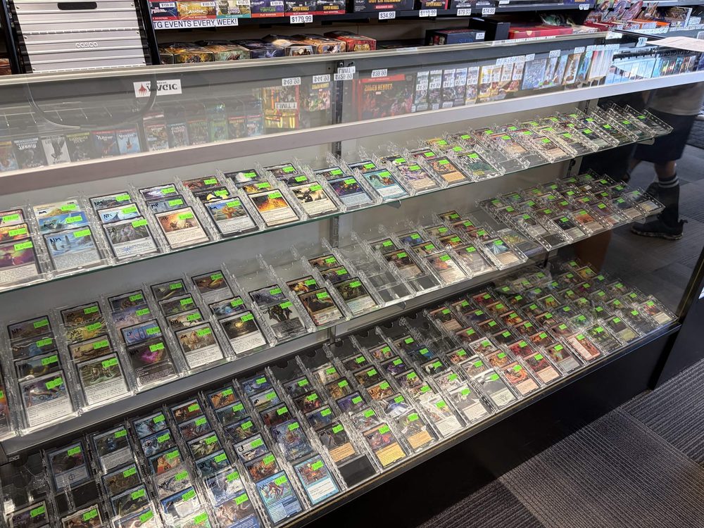 A display case of singles at the Cardtropolis TCG counter